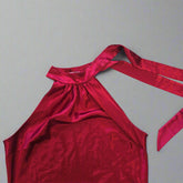 Red satin garment on a tiled floor
